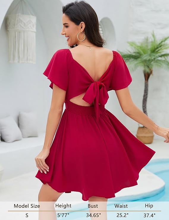 Damklänning med hjärtformad halsringning och knut framtill