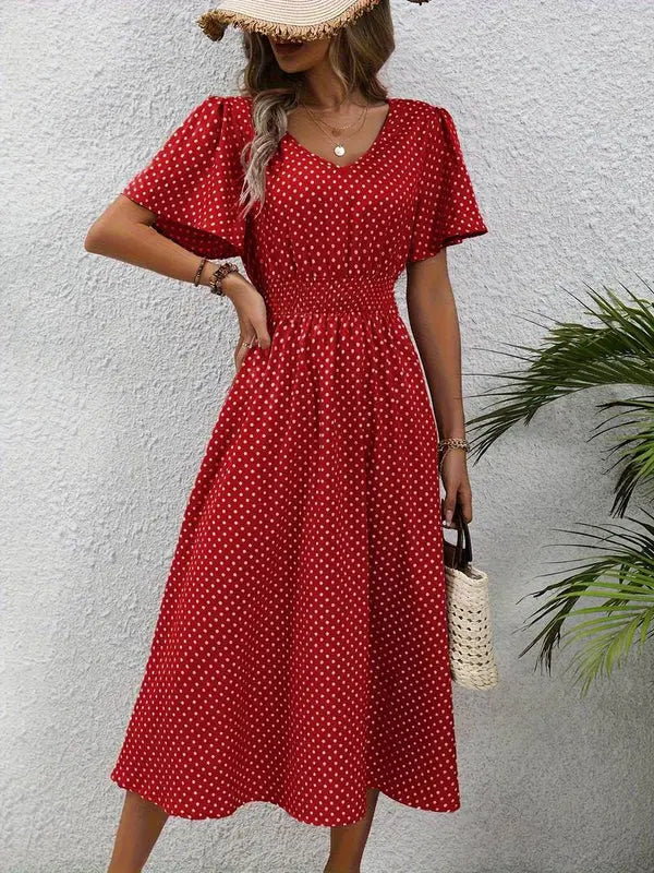 Elegant sommarklänning med prickar för damer
