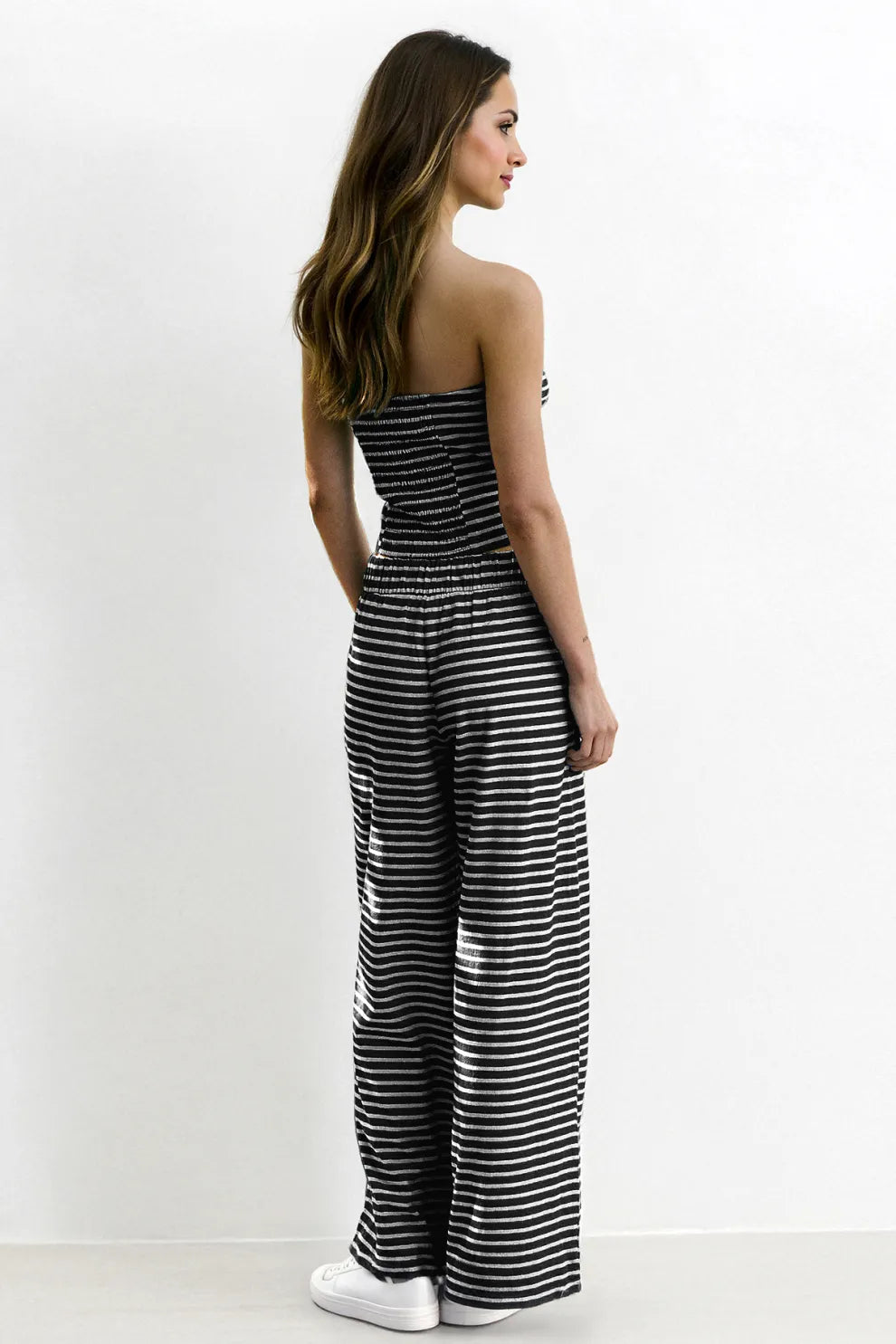 Set med randig tubtop och byxor med vida ben för damer